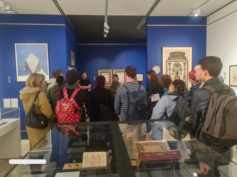 Guests viewing the Quran exhibition. Introduced by the curator.