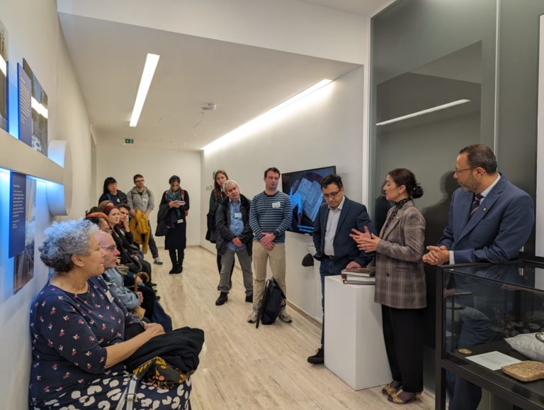 Gallery curator speaking with guests